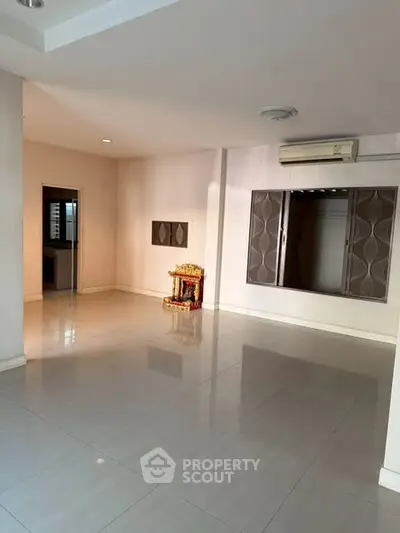 Spacious empty room with modern air conditioning and decorative wall panels