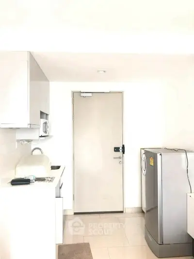 Modern kitchen with sleek appliances and minimalist design