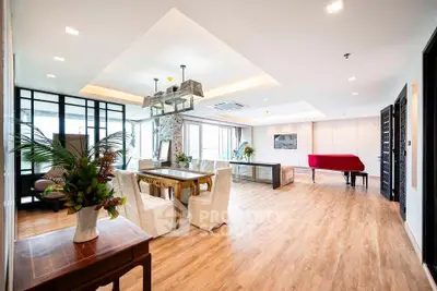 Spacious and elegant living room with modern decor and wooden flooring