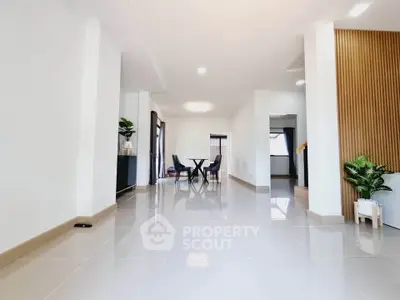 Spacious modern living room with sleek tile flooring and elegant decor