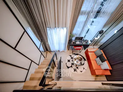 Modern loft apartment with stylish living room and workspace
