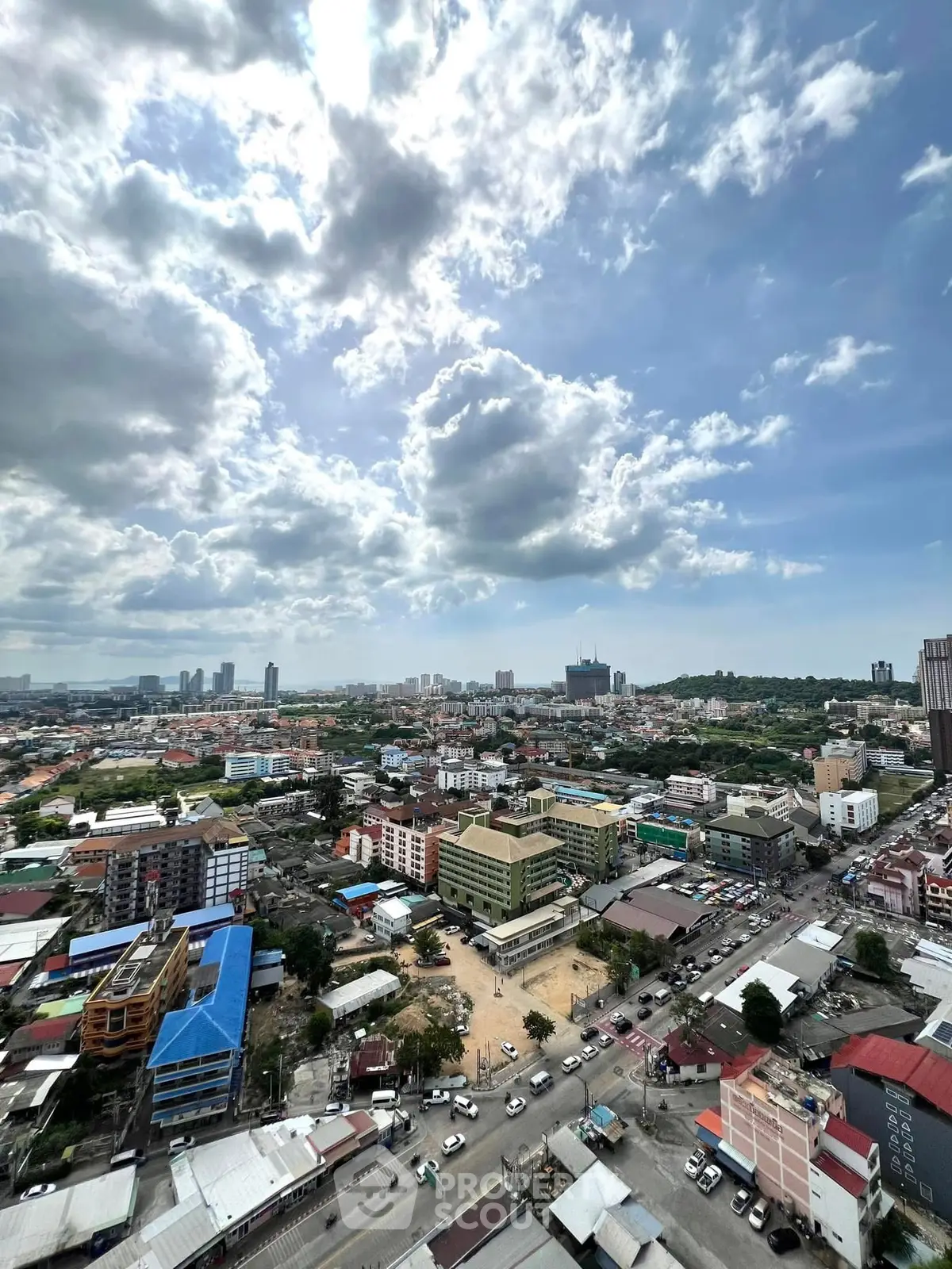 Stunning cityscape view from high-rise building showcasing urban skyline and vibrant neighborhood.