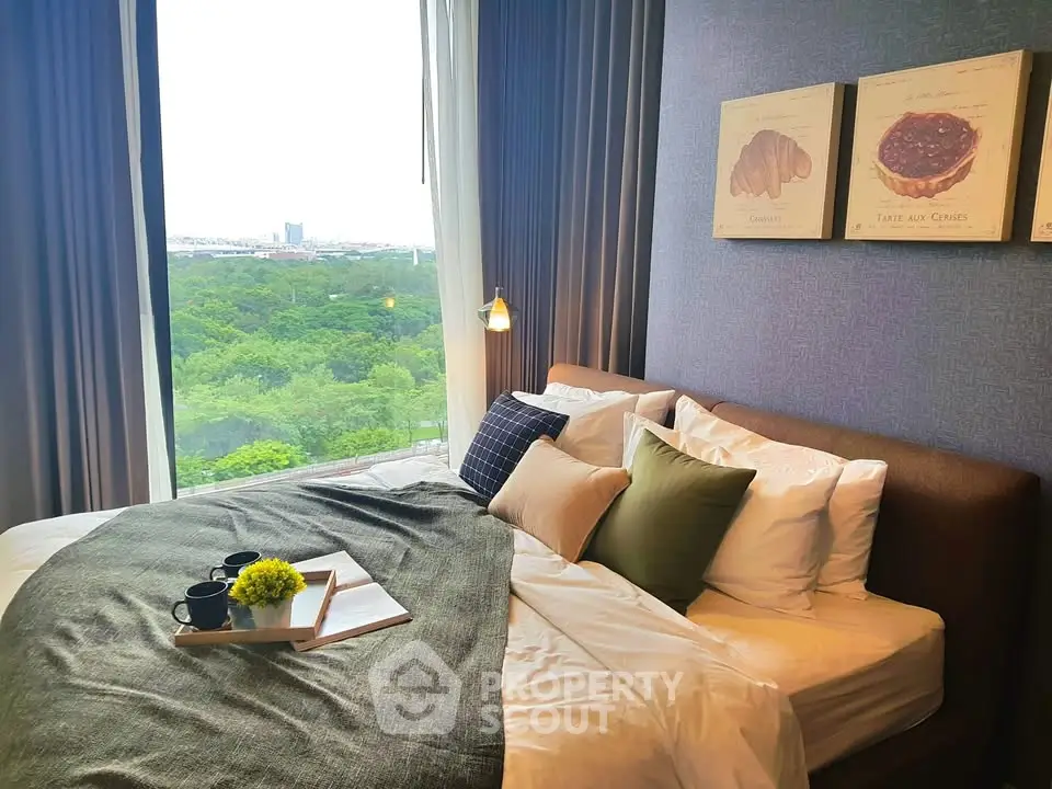 Luxurious bedroom with stunning park view, cozy bedding, and elegant decor for ultimate relaxation.