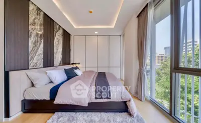 Luxurious modern bedroom with floor-to-ceiling windows and elegant decor