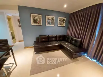 Stylish living room with black leather sectional sofa and modern decor