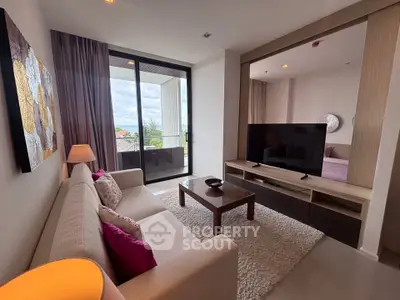 Modern living room with cozy sofa, stylish decor, and balcony view in a contemporary apartment.