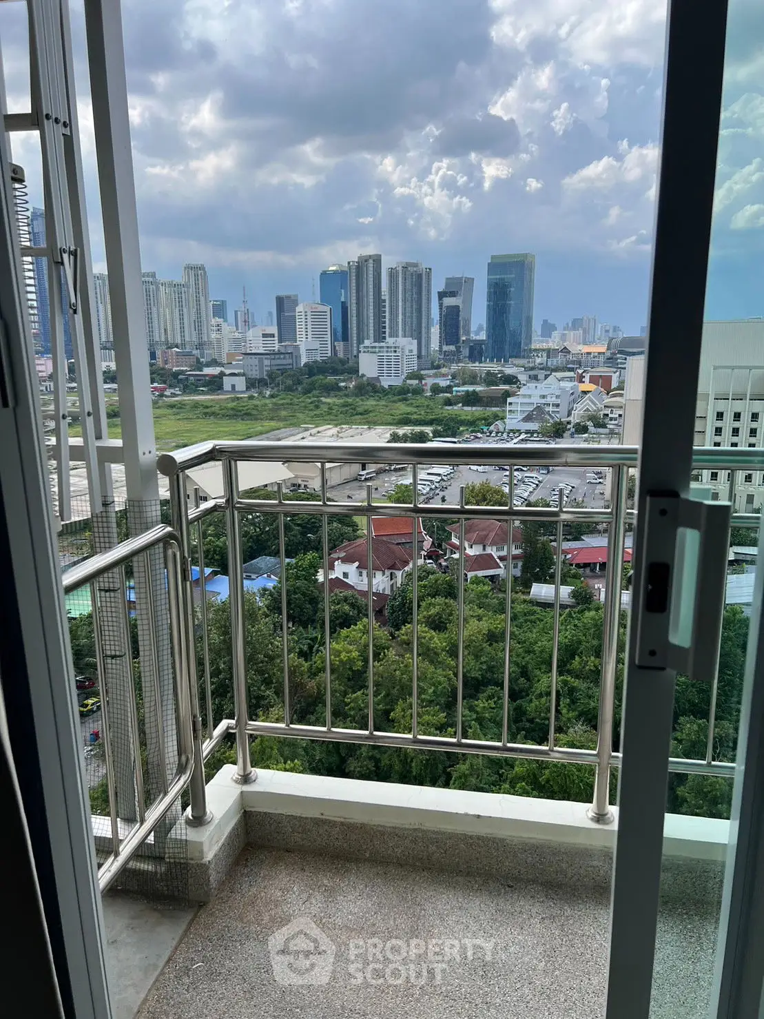 Stunning cityscape view from a high-rise balcony, perfect for urban living enthusiasts.