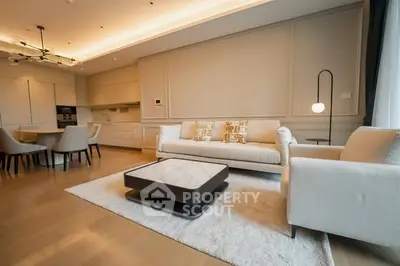 Luxurious open-layout living room with modern furniture and elegant lighting