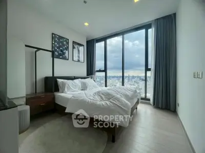 Luxurious bedroom with stunning city view and modern decor