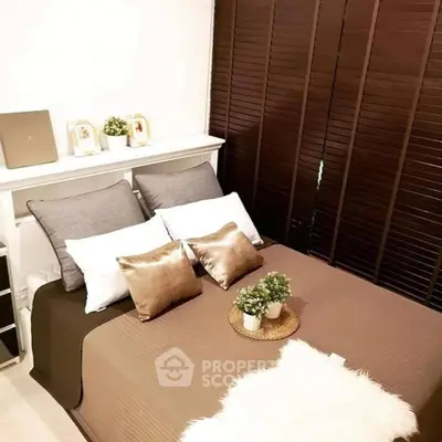 Cozy bedroom with stylish decor and plush bedding, perfect for relaxation and comfort.