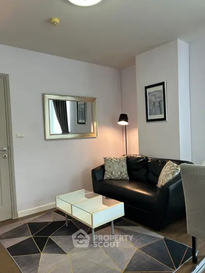 Stylish living room with modern decor and cozy seating area.