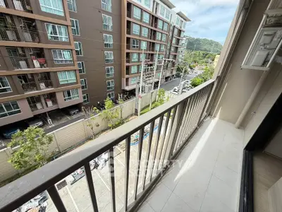 Spacious balcony with scenic view in modern apartment complex