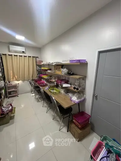 Spacious study room with modern shelving and ample workspace, perfect for productivity and organization.