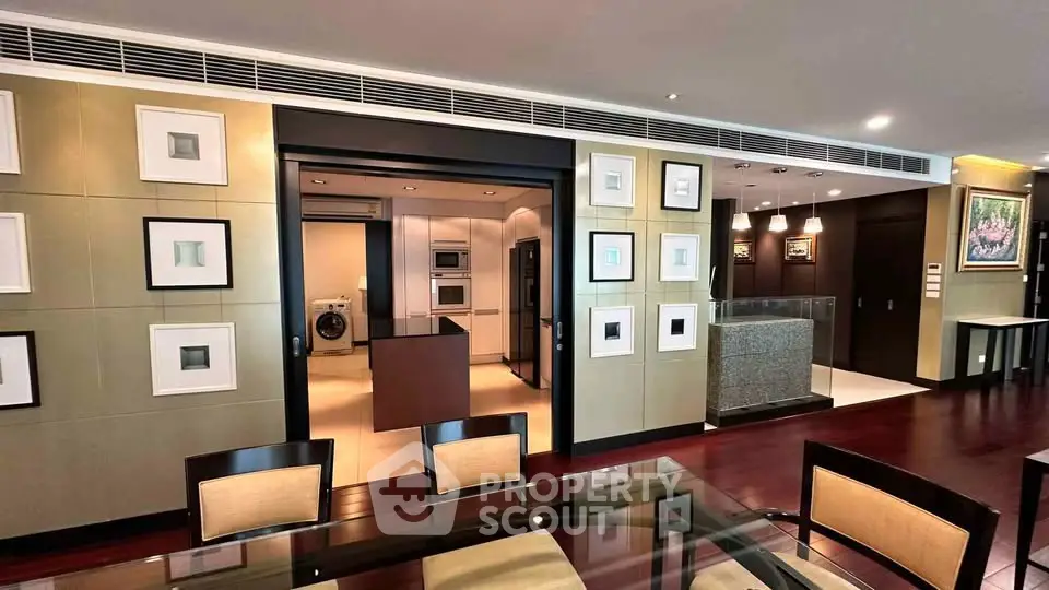 Luxurious open-plan living and dining area with modern kitchen and elegant decor.
