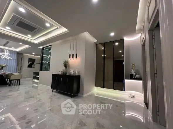 Luxurious modern living room with elegant lighting and marble flooring