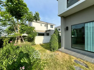 Charming modern home with lush garden and spacious outdoor area, perfect for family living.