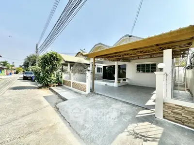 Charming single-story home with spacious driveway and modern exterior design
