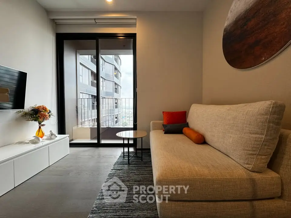 Modern living room with cozy sofa and balcony view in urban apartment
