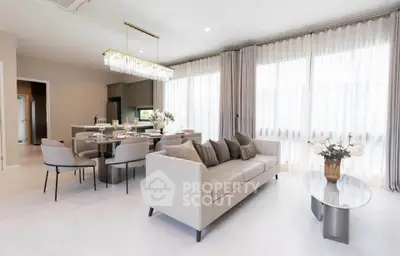 Luxurious open-plan living room with elegant dining area and modern decor