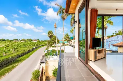 Stunning balcony view with lush greenery and modern interior, perfect for relaxation and enjoying nature.
