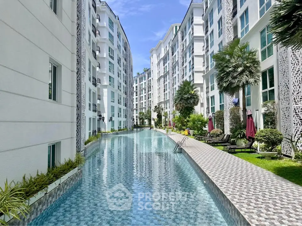Luxurious apartment complex with stunning pool and lush gardens