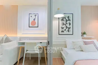 Modern studio apartment with stylish decor and cozy furnishings, featuring a compact living and sleeping area.