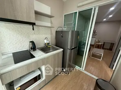 Modern compact kitchen with sleek appliances and open layout