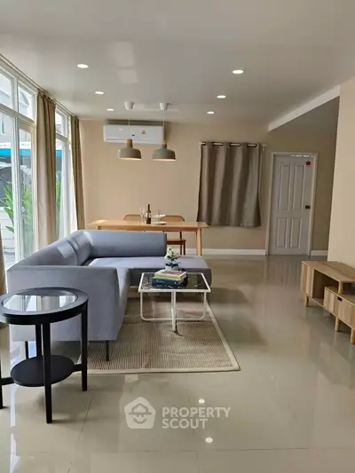Spacious modern living room with elegant furniture and natural light