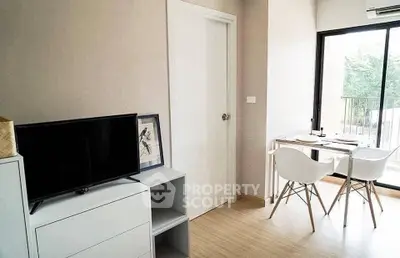 Modern living room with minimalist decor and balcony view