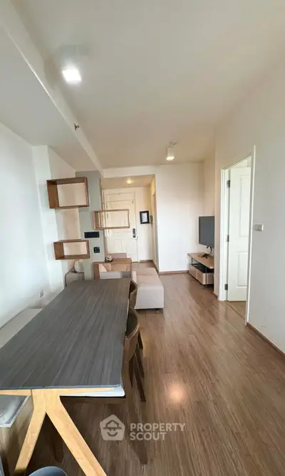 Modern living room with wooden flooring and stylish furniture