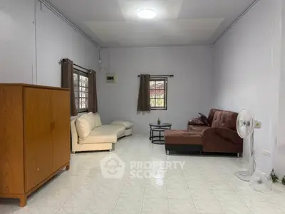 Spacious living room with cozy sofas and natural light