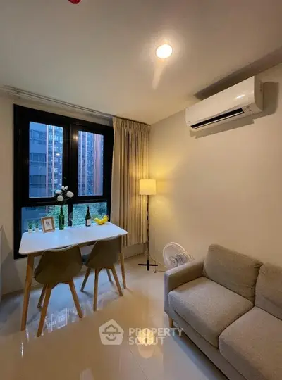 Cozy living room with modern decor and large window view