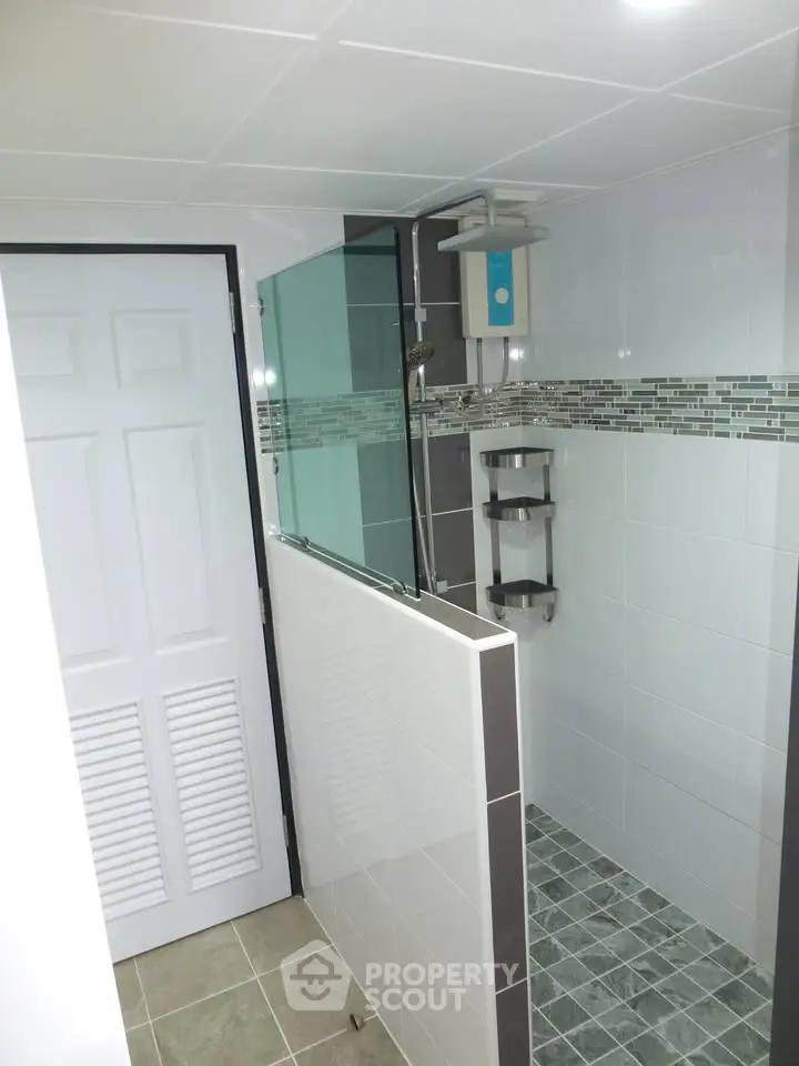 Modern bathroom with sleek shower design and stylish tile accents