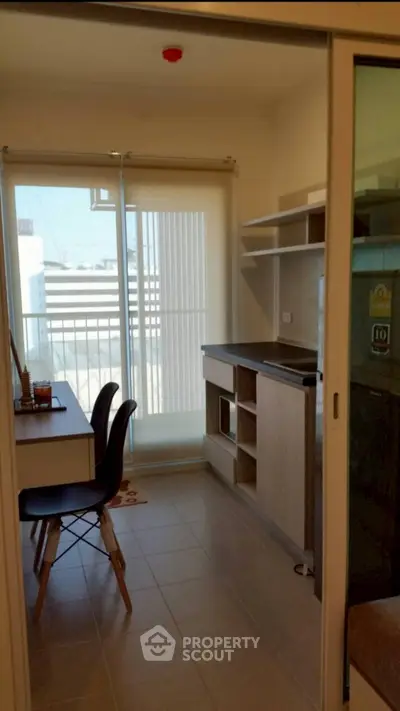 Modern kitchen with open layout and dining area in a bright apartment