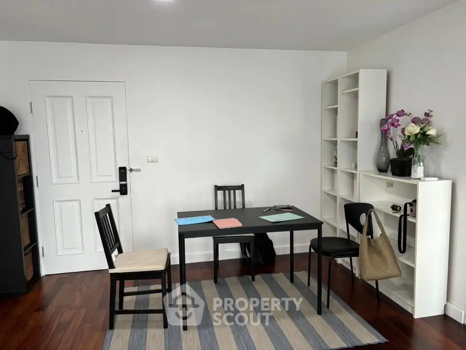 Modern study room with sleek furniture and hardwood floors, perfect for productivity and style.