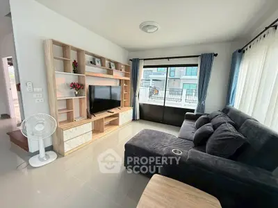 Modern living room with sleek furniture and large window view