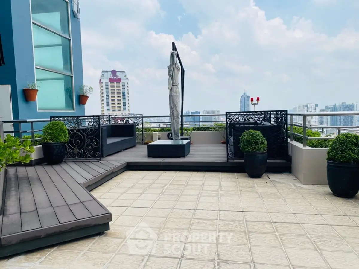 Stunning rooftop terrace with panoramic city views and elegant decor.