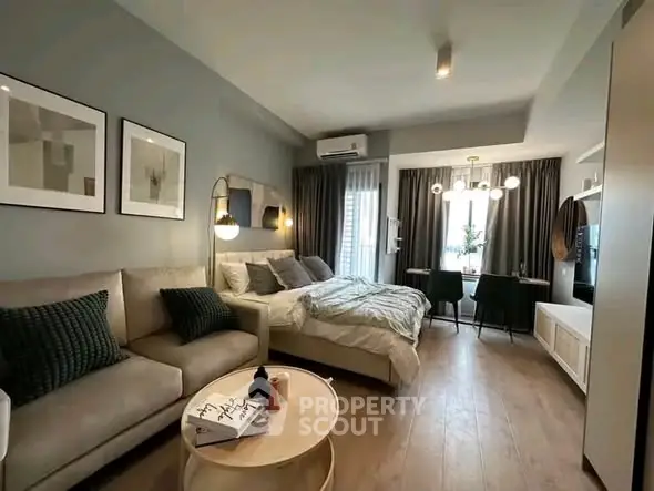 Modern studio apartment with cozy living area and stylish decor