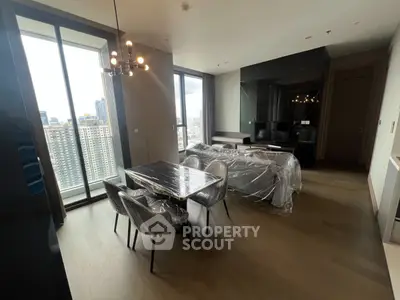 Modern living room with dining area and city view in luxury apartment
