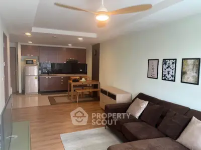 Spacious living room with modern kitchen in open layout apartment