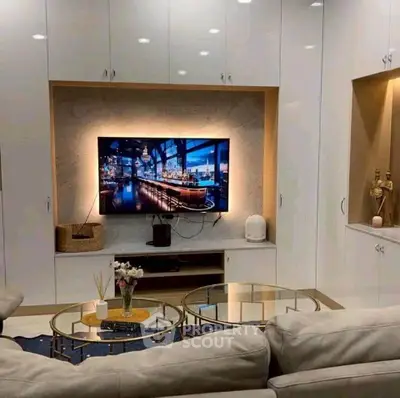 Luxurious living room with modern decor and built-in TV unit
