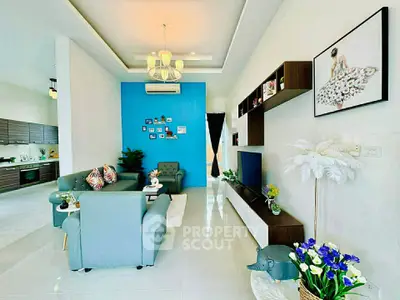 Stylish modern living room with blue accent wall and elegant decor