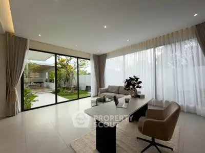 Luxurious living room with garden view and modern furnishings