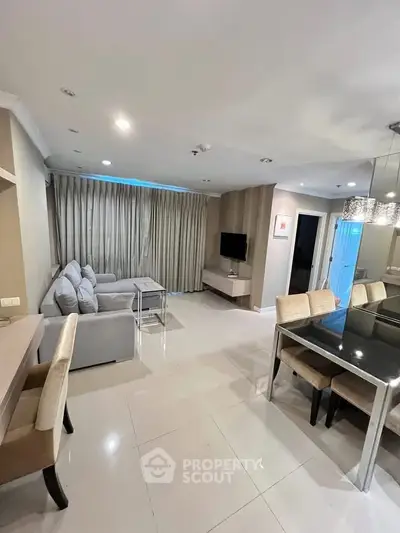 Spacious modern living room with elegant dining area and cozy seating, perfect for entertaining.