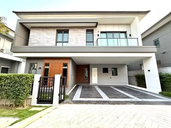 Modern two-story house with sleek design and spacious driveway
