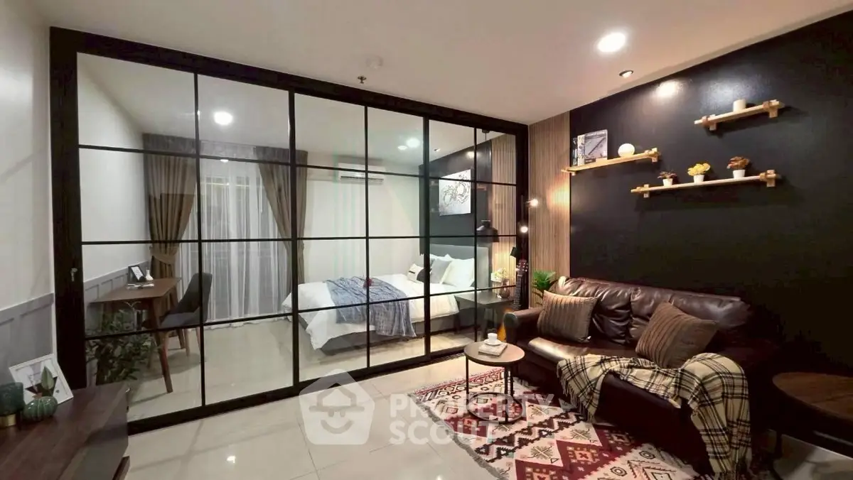 Modern living room with glass partition and cozy bedroom view