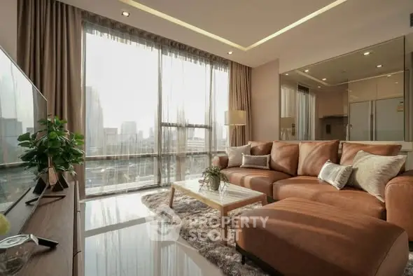 Luxurious living room with city view, modern decor, and plush seating in high-rise apartment.