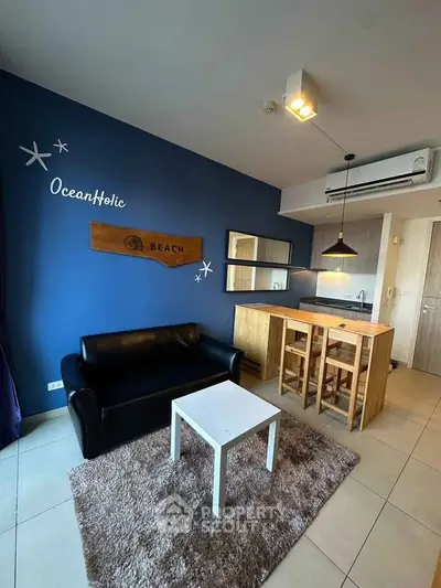 Modern living room with stylish decor and open kitchen layout in a cozy apartment.