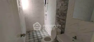 Modern bathroom with stylish tiles and sleek fixtures