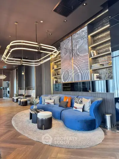 Luxurious modern living room with stylish blue sofa and unique lighting fixtures